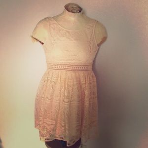Sleeveless short lace dress.